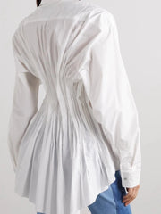 White long-sleeve shirt with pleated design on a plain background