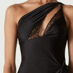 Black one-shoulder dress with lace detailing on a neutral background