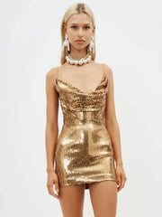 Gold sequin dress worn by a model on a white background