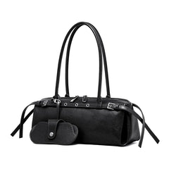 Black handbag with a strap and attached pouch on a white background