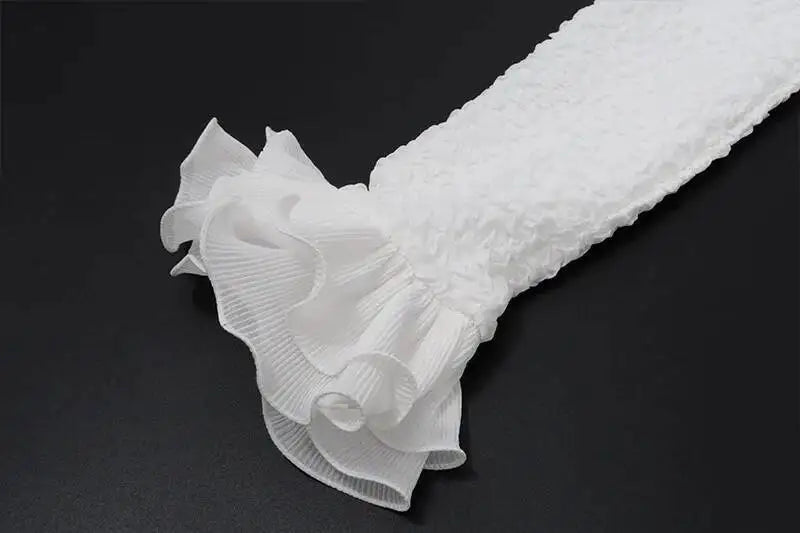 Close-up of a white textured fabric on a black background