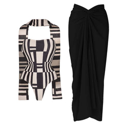 Abstract geometric print swimsuit with a black draped maxi skirt