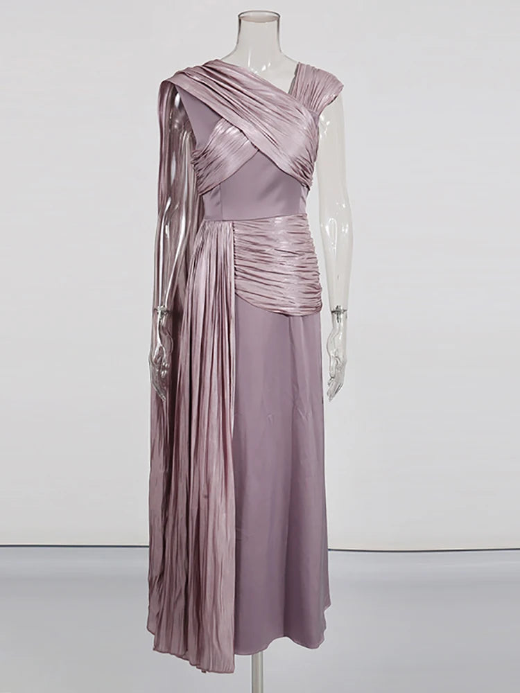 Mauve evening gown on a mannequin against a white background