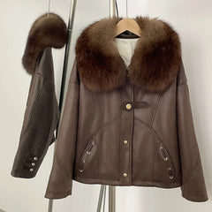 Brown leather jacket with fur collar on a hanger against a white background