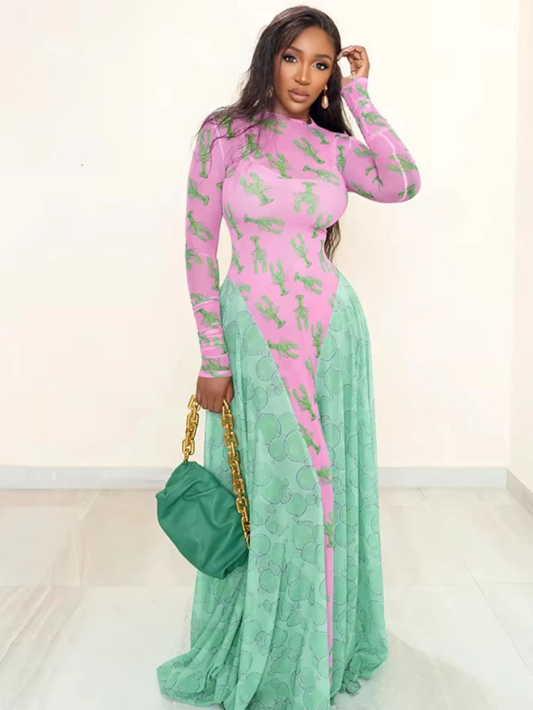 Woman wearing a pink and green dress with a gold handbag on a white background