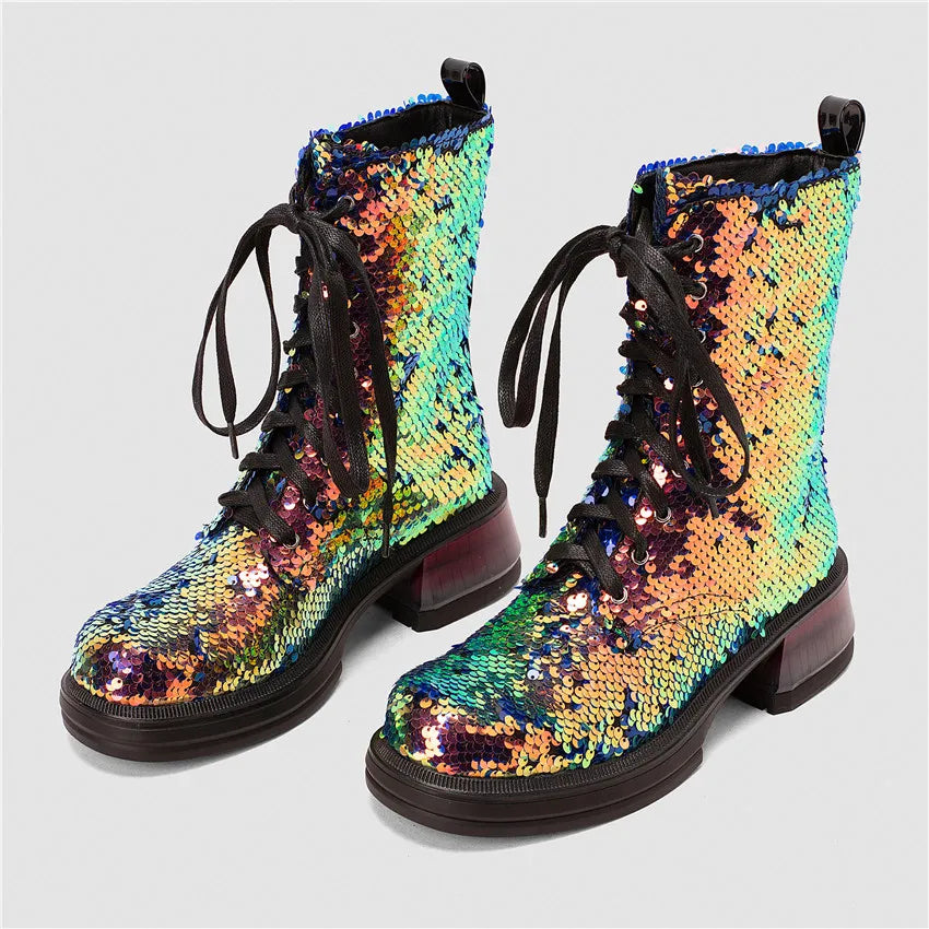 Pair of colorful sequin boots on a light gray background