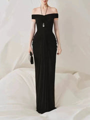 Model wearing an off shoulder folds column dress