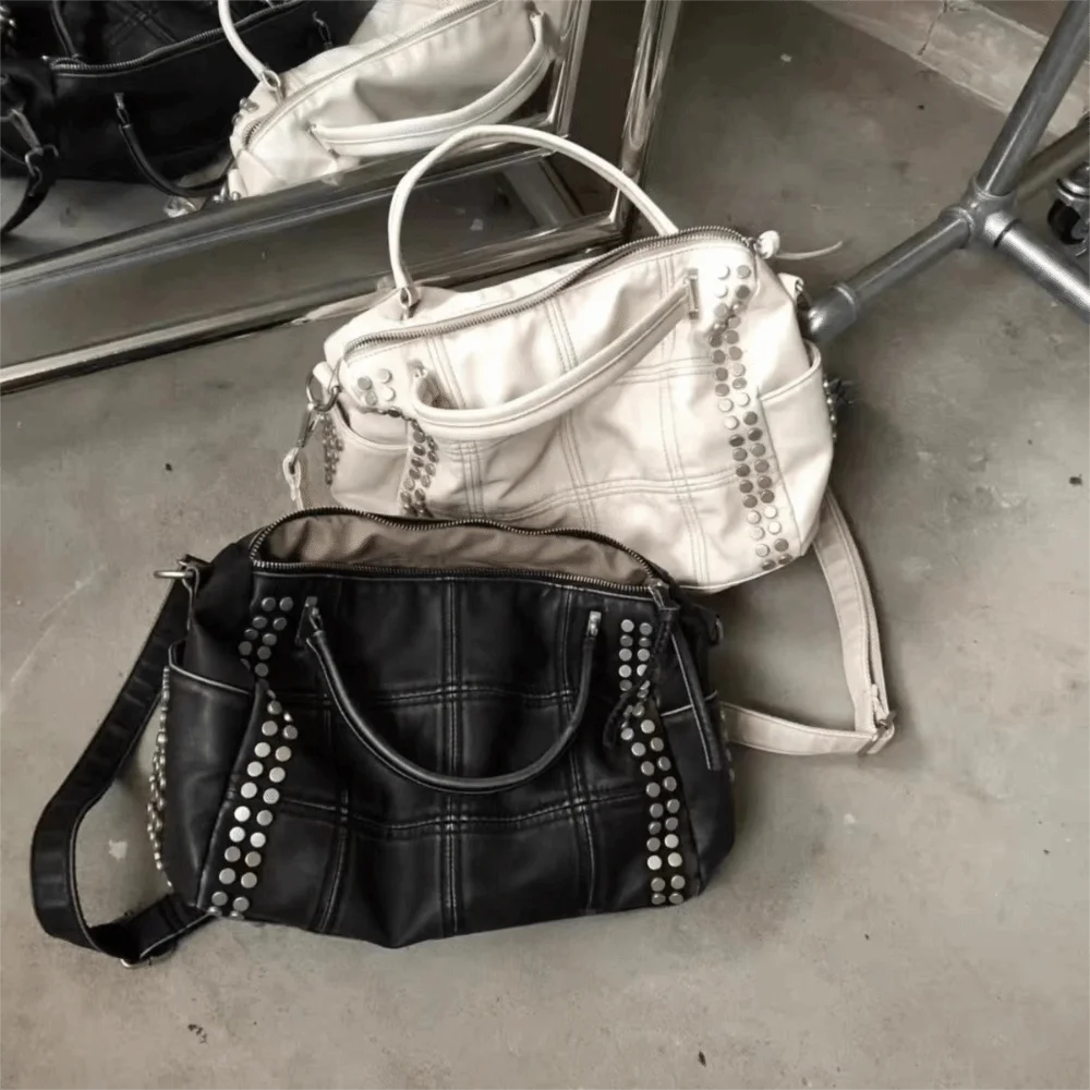 Black quilted rivet tote bag