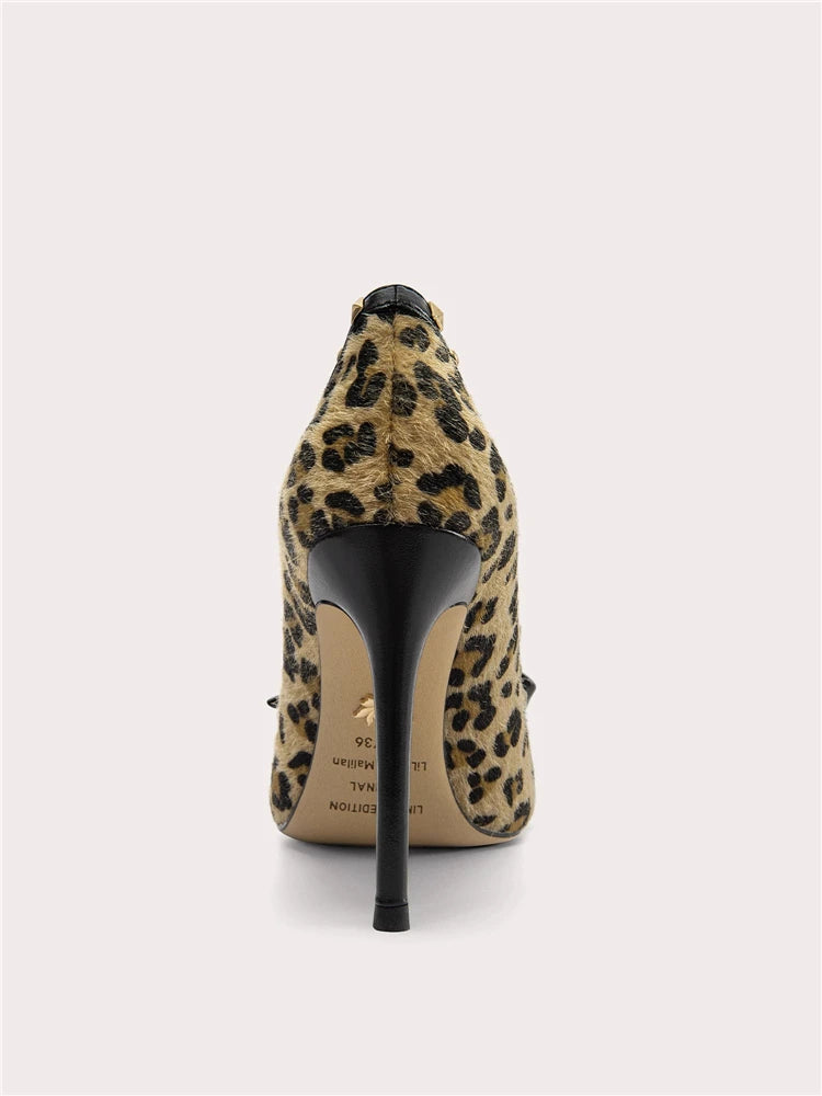 Leopard print high-heeled shoe on a light gray background