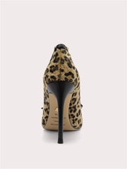Leopard print high-heeled shoe on a light gray background