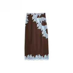 Brown skirt with white lace trim on a white background
