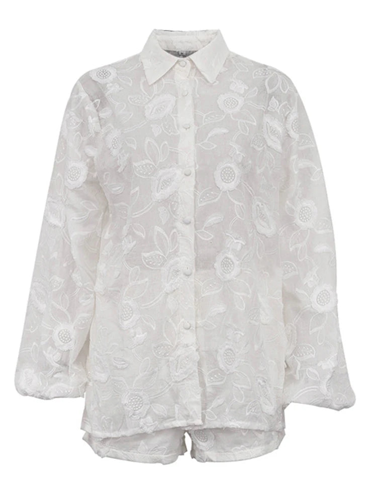 White floral lace blouse on a white background