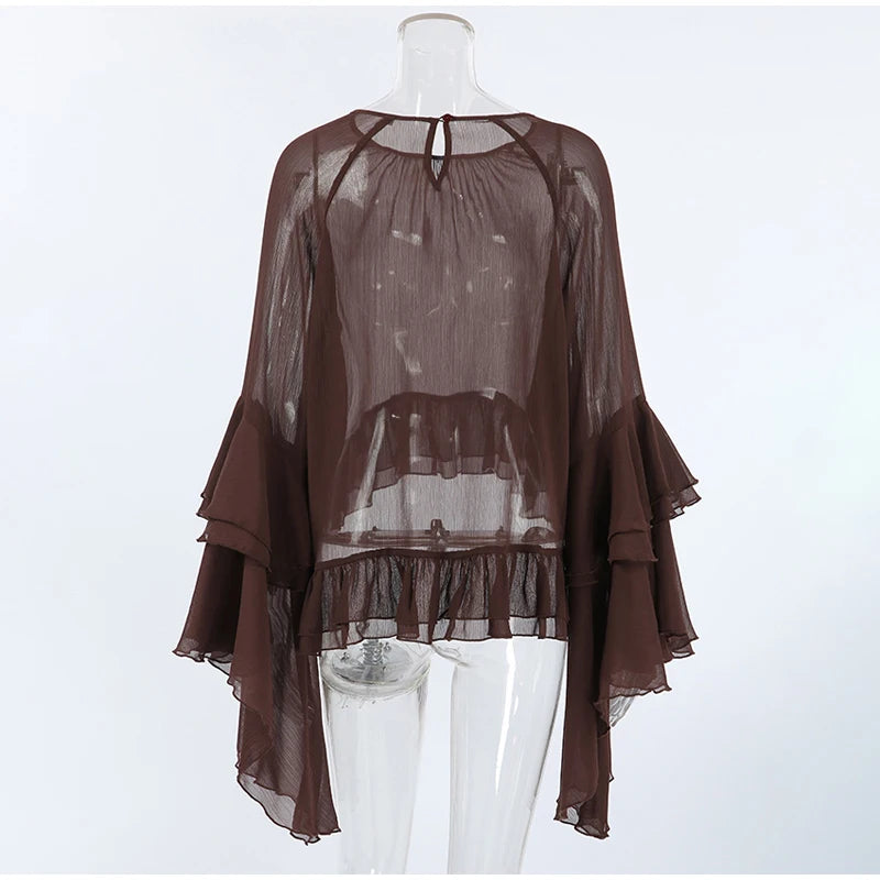 Brown sheer blouse on a mannequin against a white background