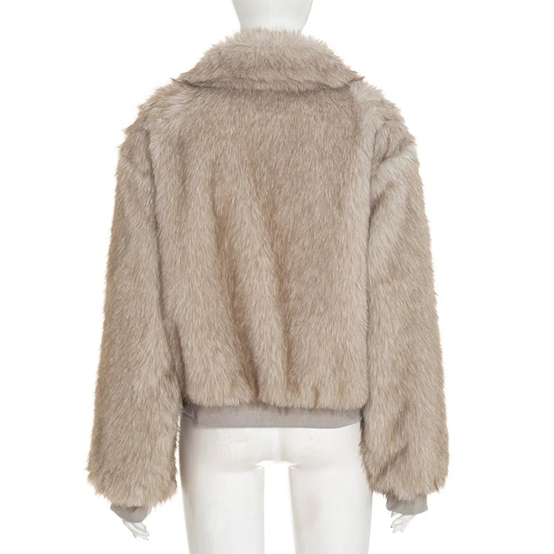 Beige faux fur jacket on a mannequin