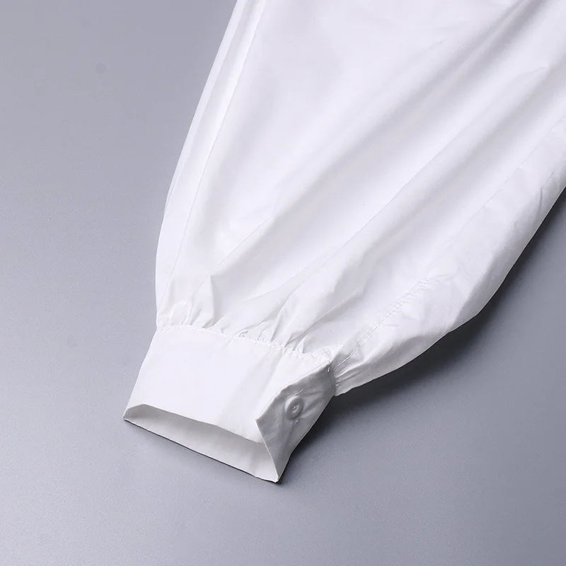 White shirt sleeve on a gray background