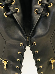Close-up of black lace-up embellished fitted blazer details