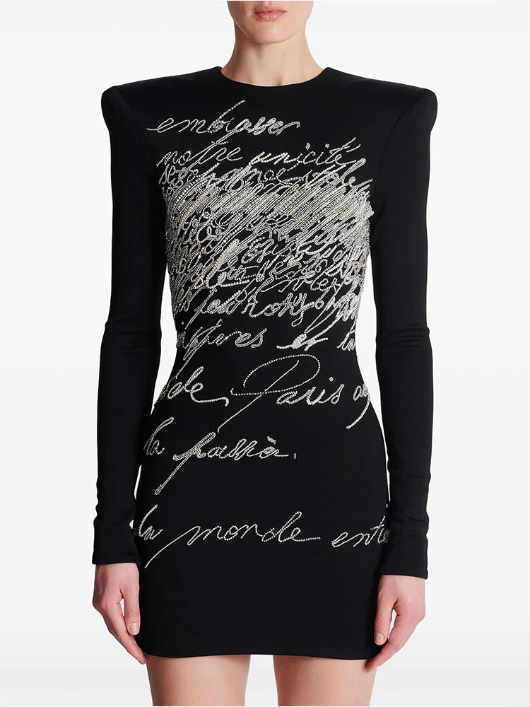 Beaded script long sleeve mini dress on mannequin
