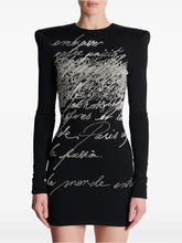 Beaded script long sleeve mini dress on mannequin