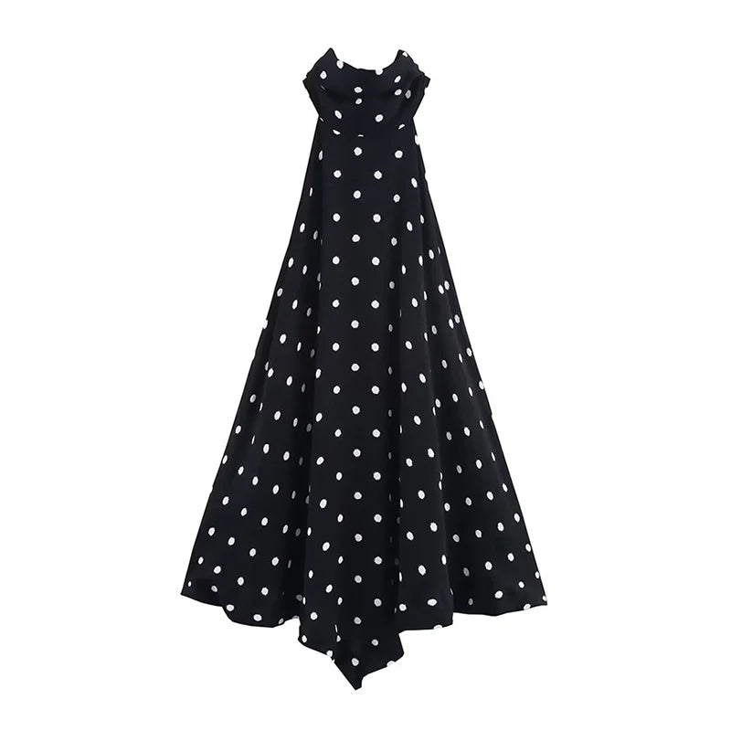 Black dress with white polka dots on a white background