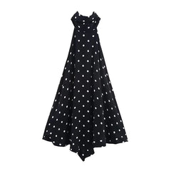 Black dress with white polka dots on a white background