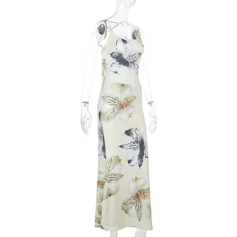Floral dress on a mannequin against a white background