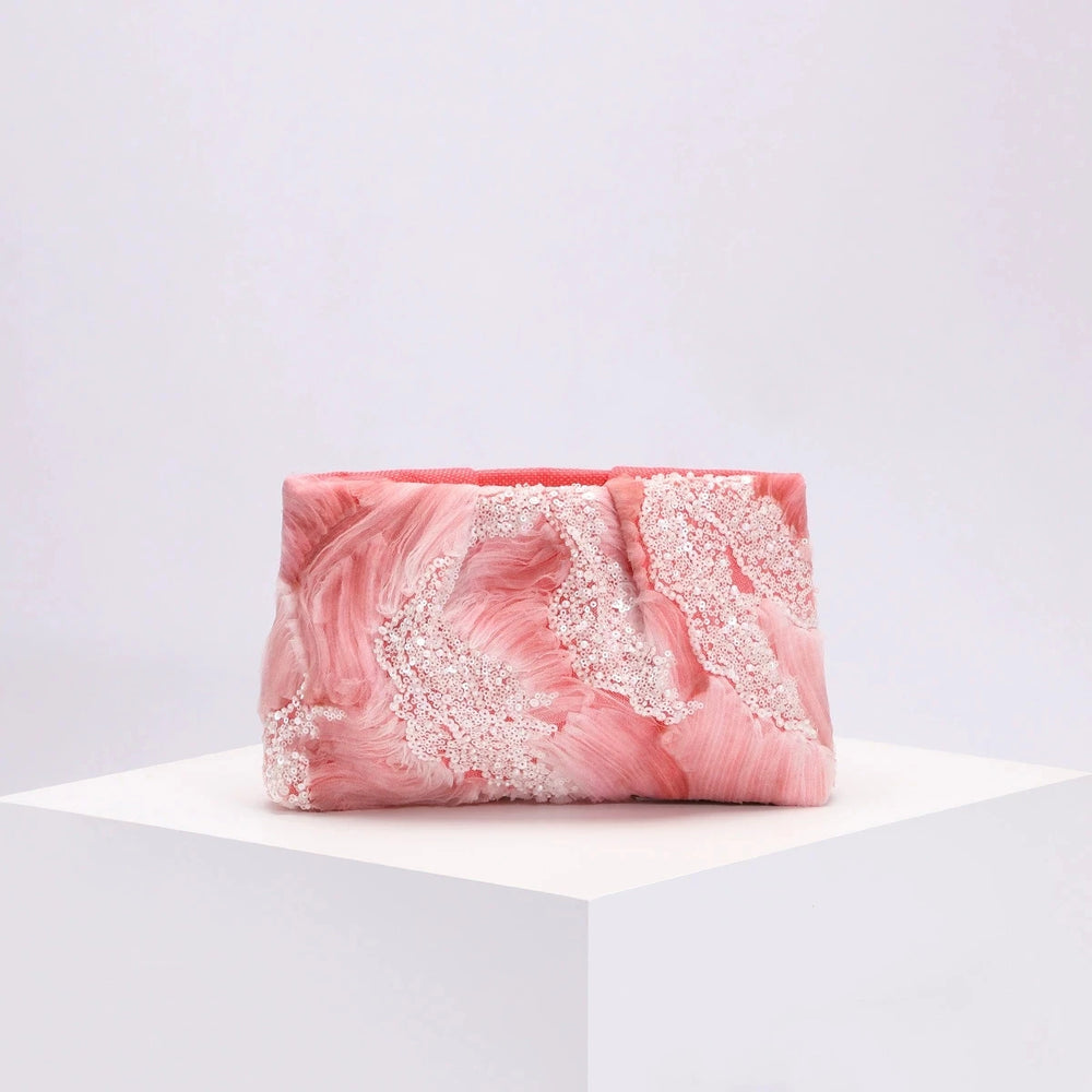 Pink and white marbled soap bar on a white background