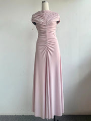 Pink evening gown on a mannequin against a white background