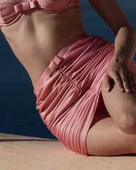 Close-up of textured pink ruched skirt