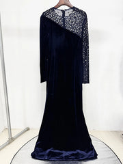 Mesh sleeved velvet gown designed for high profile occasions