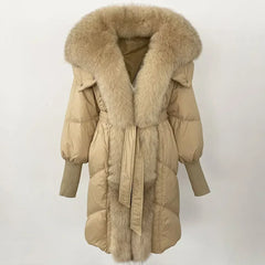 Beige puffer coat with fur collar on a white background