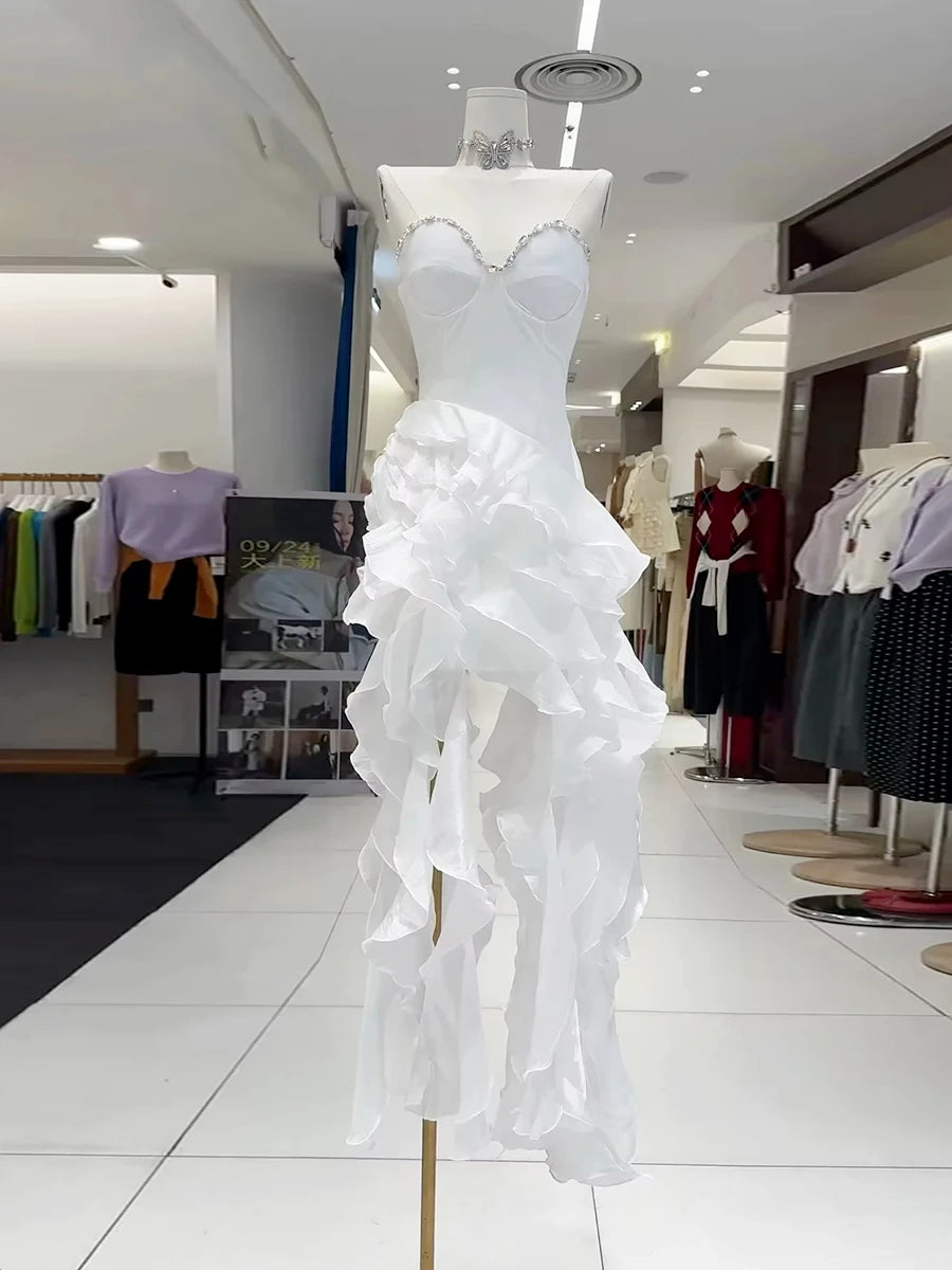 White ruffled dress on a mannequin in a clothing store setting