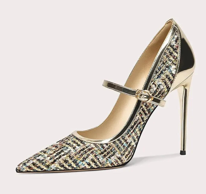 High-heeled shoe with a decorative strap on a white background