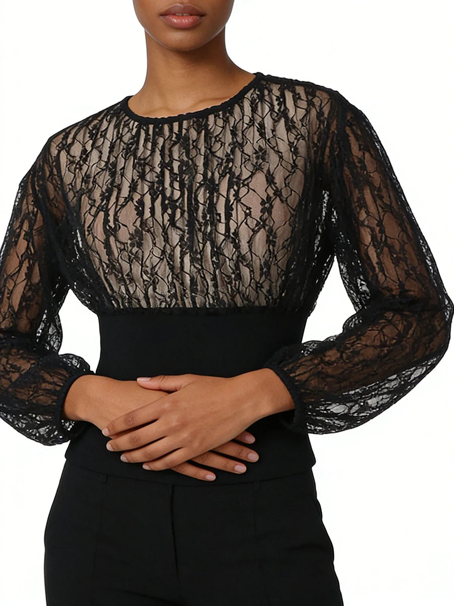 Model wearing black lace long sleeve top from front
