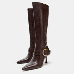 Pointed toe stiletto heel knee high boots with buckle detail.