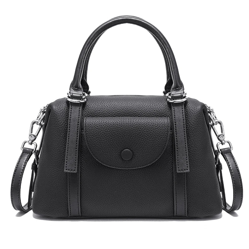 Black handbag with a chain strap on a white background