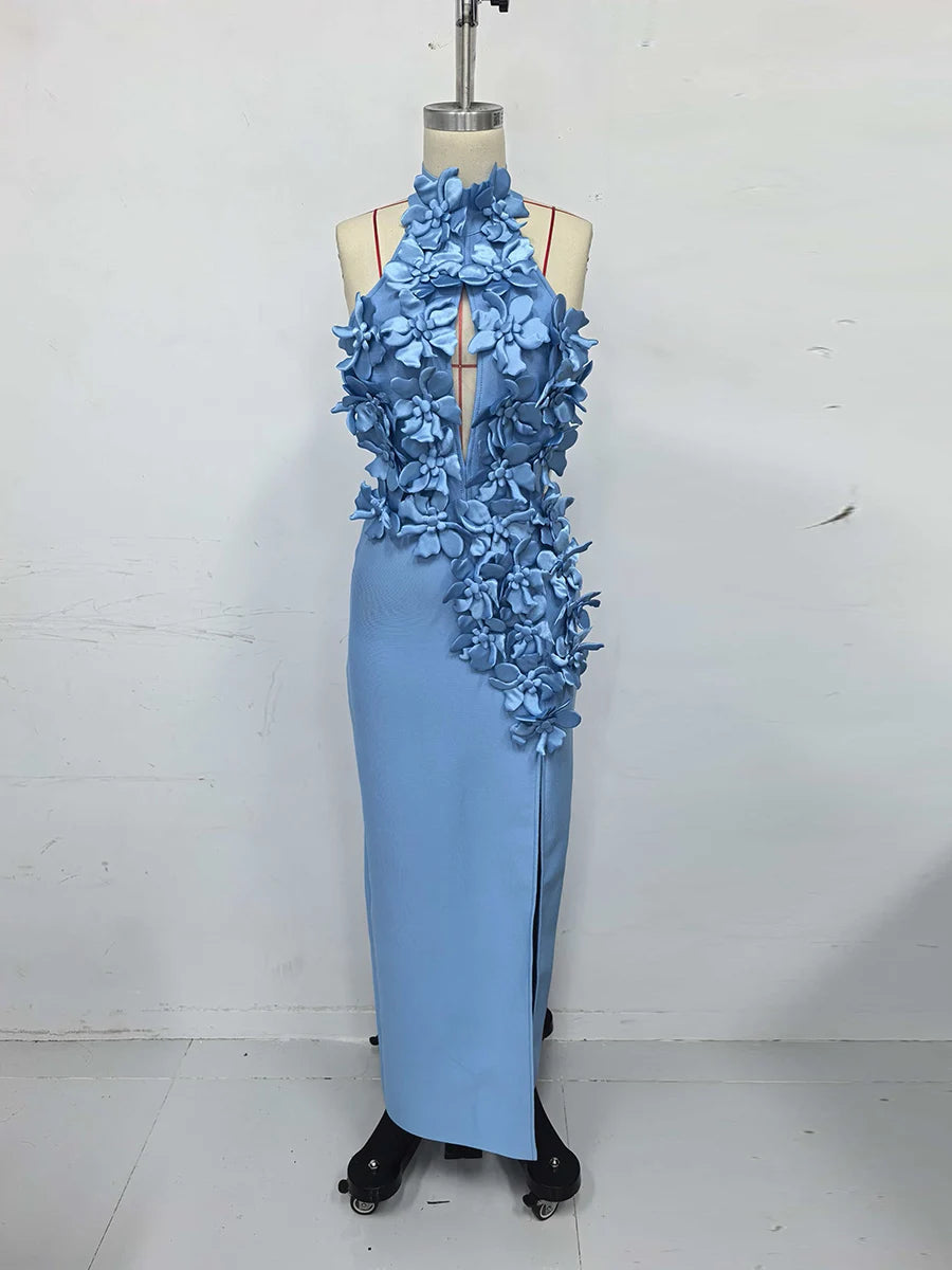 Light blue evening gown with floral embellishments on a mannequin against a white background