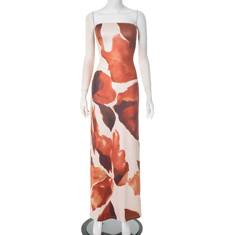 Mannequin wearing a dress with abstract orange and white pattern on a white background