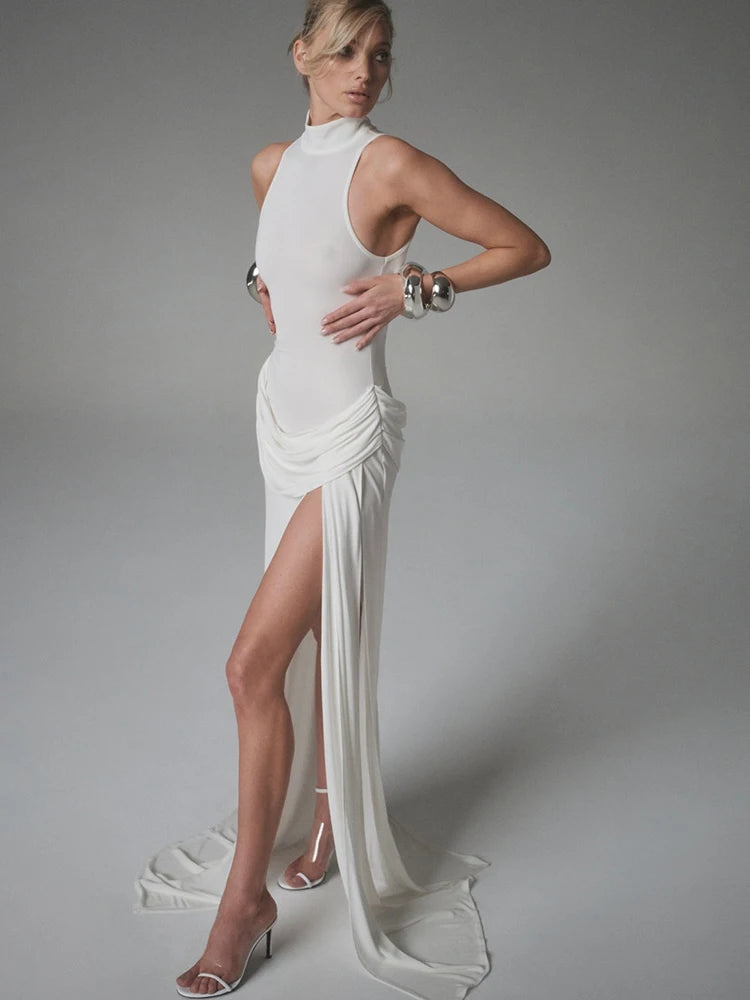 Model wearing white mock neck high slit maxi dress