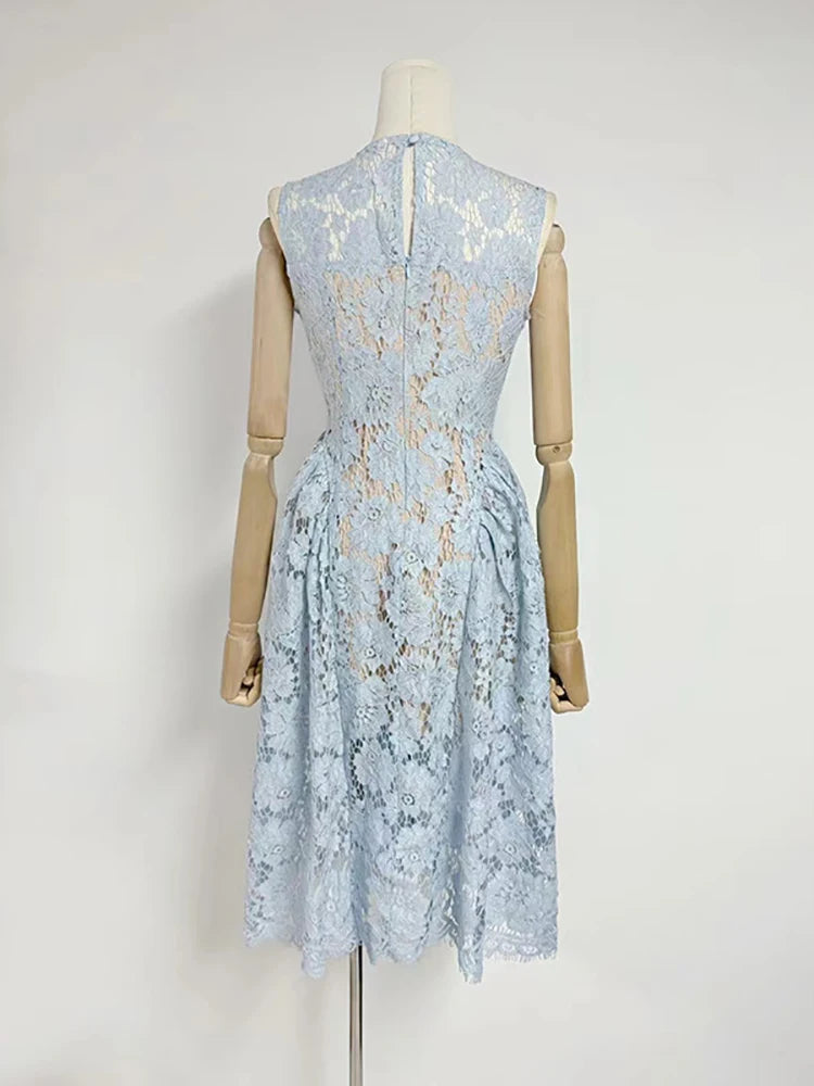 Light blue lace dress on a mannequin against a white background