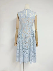 Light blue lace dress on a mannequin against a white background