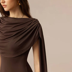 Brown draped garment on a neutral background