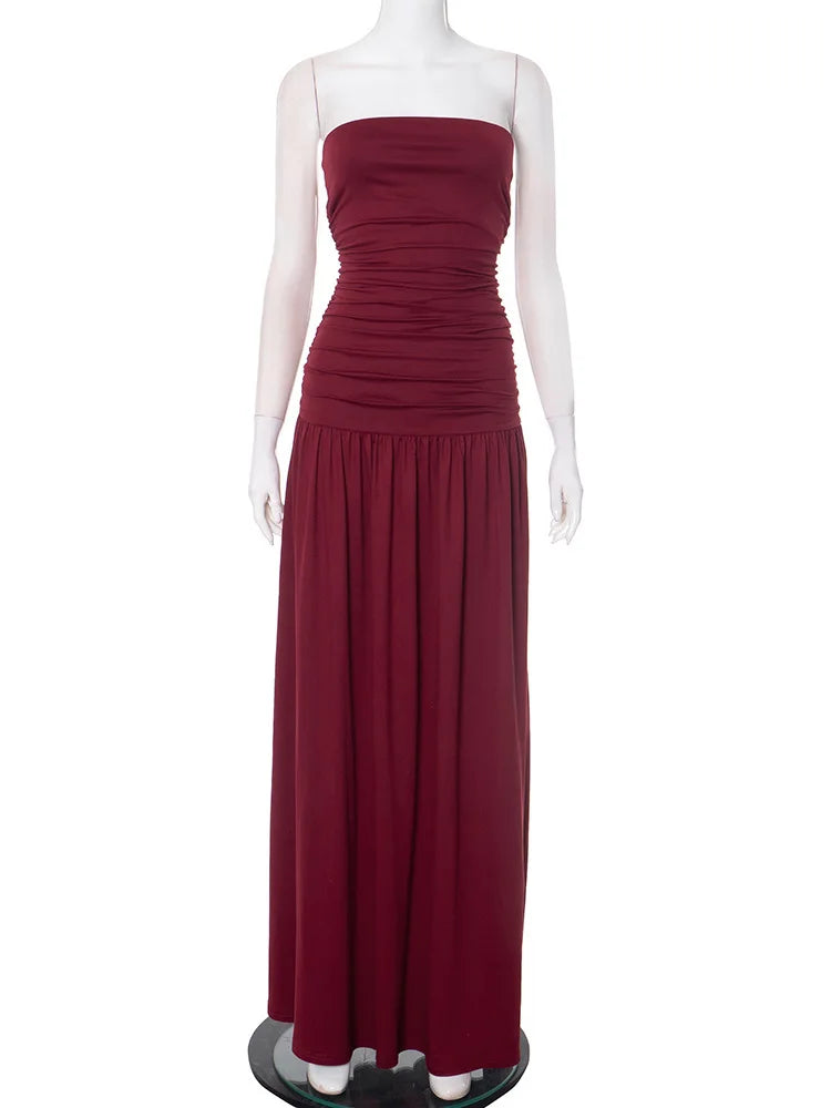 Burgundy strapless gown on a mannequin against a white background