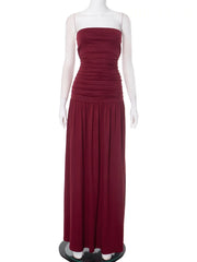 Burgundy strapless gown on a mannequin against a white background