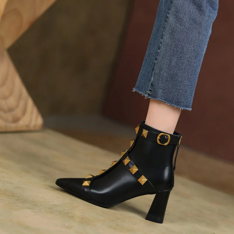 Black studded pointed toe block heel ankle boots detail
