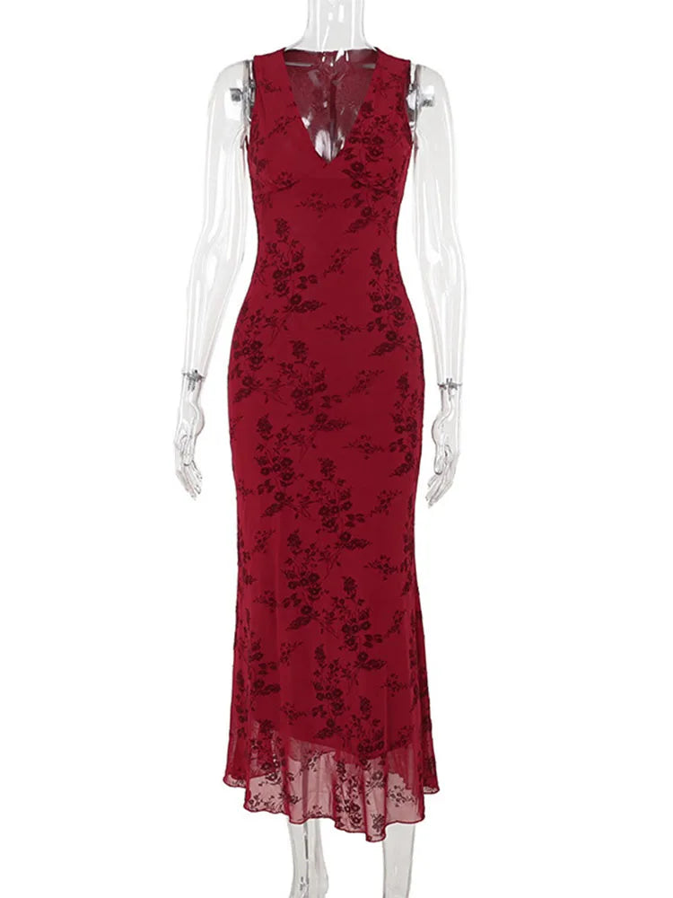 Red lace dress on a mannequin against a white background