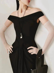Close-up of the off shoulder folds column dress neckline