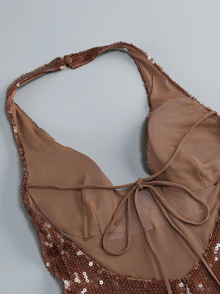 Brown bikini top with sequin details on a light gray background