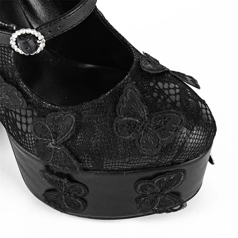 Black lace platform shoe with butterfly details on a white background