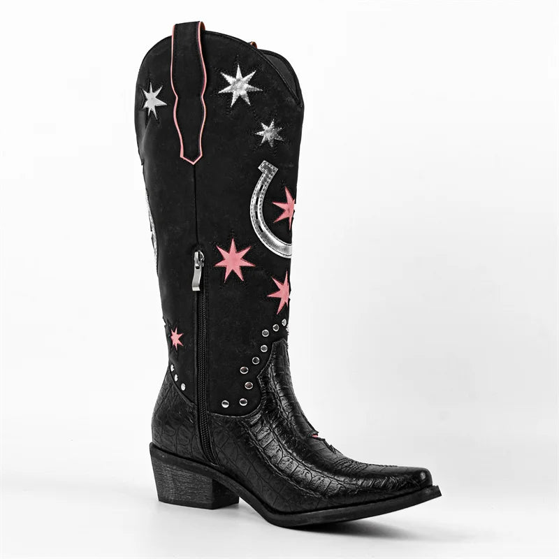 Black cowboy boot with star and horseshoe designs on a white background