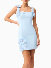 Light blue dress with floral straps on a white background